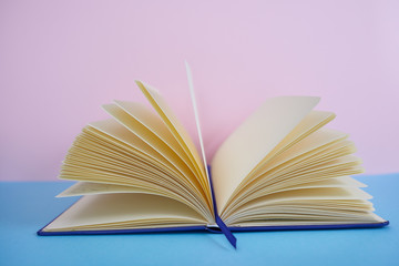  Colorful background with a notebook or books on a table and decorative objects.