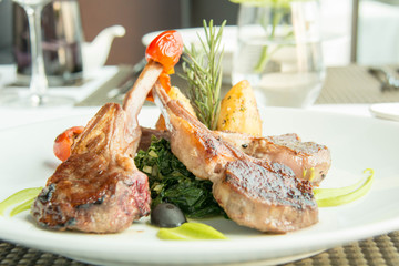  delicious lamb steak with Spinash background;