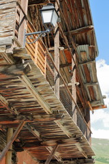 Close-up on a traditional wooden house with its traditional balcony in Saint Veran village, Queyras Regional Natural Park, Southern Alps, France