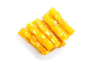 yellow traditional turkish delight (rahat lokum) with peanuts isolated on white background. top view.
