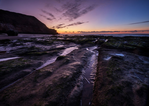 Winter twilight with razor shell and cloud formation, Orcombe Point, Exmouth, Devon