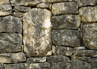 Grunge texture of stone bricks. Ancient wall background