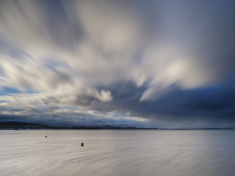 Stormy rain clouds blow down the Exe estuary at Exmouth, Devon