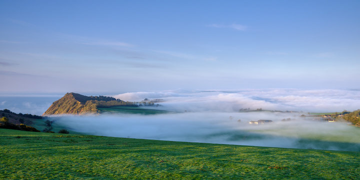 Spring with extensive fog and mist over Otterton and Ladram Bay viewed from Peak Hill, Sidmouth, Devon