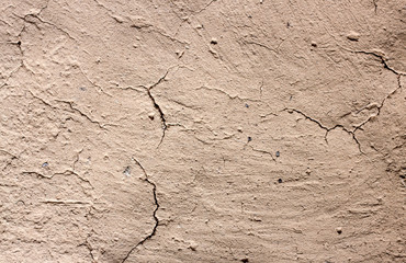 Old cob wall with cracked surface