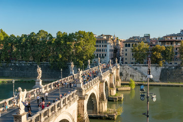 Castle of the Holy Angel bridge with people and Rome historic centre