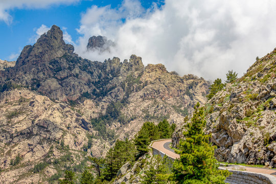Road running through a mountain pass, past Bocca di u Pargulu, in central Corsica, France, Mediterranean