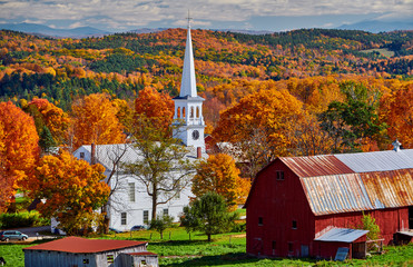 Congregational Church and farm with red barn at sunny autumn day in Peacham, Vermont, USA - 281014351