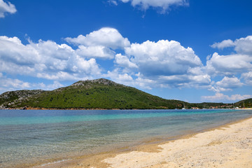Landscape with beach, the sea and the beautiful clouds in the blue sky