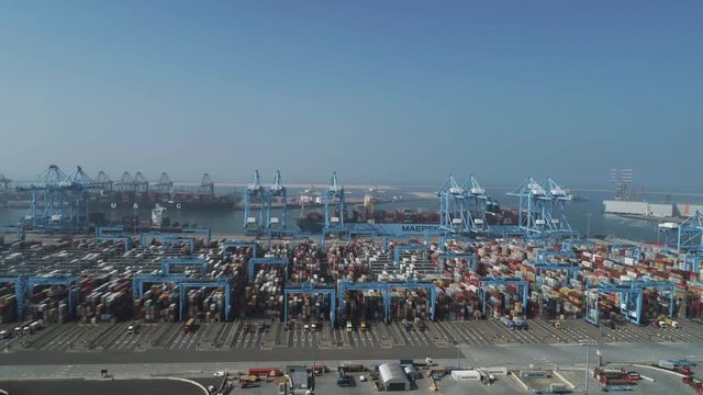 Rotterdam, The Netherlands. Container terminal in Dutch harbor Rotterdam with cargo ships moored for loading and unloading freight