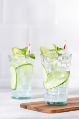 Refreshing cucumber cocktail with lime and mint