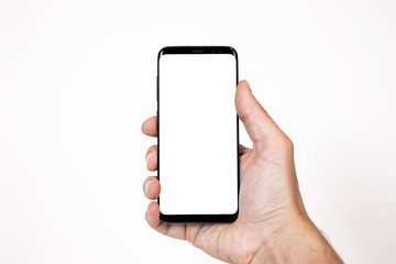 Smartphone mockup image of a man hand holding black mobile phone with blank screen on isolated background