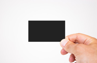 Man holding black business card mockup on isolated background