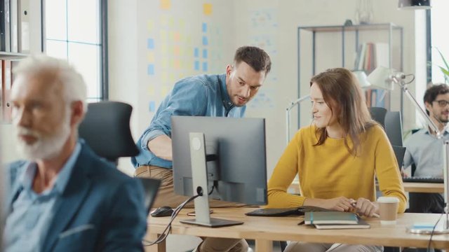 In the Busy Office: Group of Professional Businesspeople Working on Desktop Computers, Talking With Colleagues. Business Management Optimizing Strartup Workflow, Works with Clients and Customers
