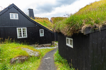 Fototapeta na wymiar Old town of capital city of Torshavn. Typical houses with peat roof ( grass roof ). Faroes Islands. Denmark. Europe.