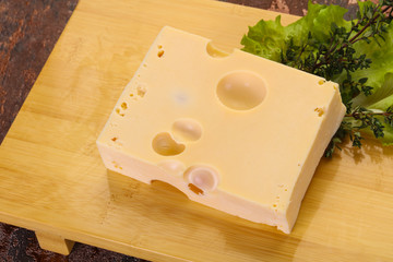 Fototapeta na wymiar Maasdam cheese brick
