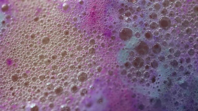 Colorful bubbles of foam bath bomb background