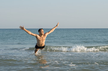 Man riding the waves in the sea