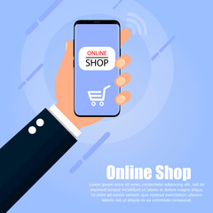 The hand holds the phone on whose screen the online store is on a blue background. The inscription is below the hand.