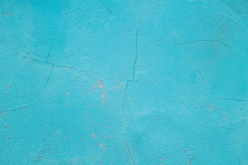 Wall fragment with scratches and cracks. Concrete weathered blue wall