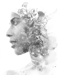 Double exposure. Paintography. Close up profile portrait of an attractive woman with strong ethnic...