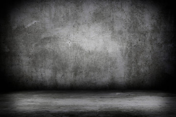Grunge interior room with concrete wall and floor. Empty concrete space.