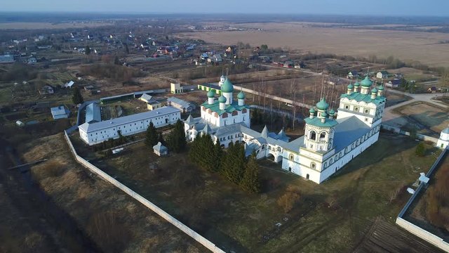 View of the Nikolo-Vyazhischskiy monastery, April evening (aerial video). Novgorod region. Russia 