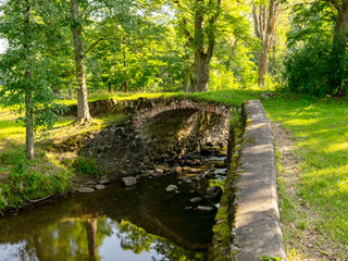 Fototapeta premium beautiful stone bridge over the river Kuja, beautiful morning light, deep shadows