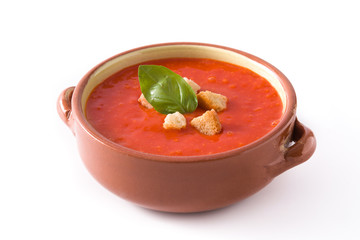 Tomato soup in brown bowl isolated on white background