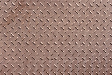 Corrugated metal surface with diamond plate texture. The diamond steel metal sheet.  Pattern of old metal diamond plate