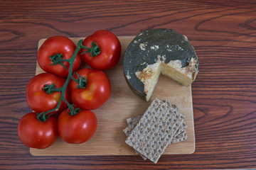  Typical Spanish food with natural products and with a wooden background.
