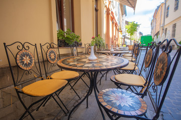 Mosaic tables in Lviv outdoor cafe 