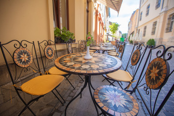 Mosaic tables in Lviv outdoor cafe 