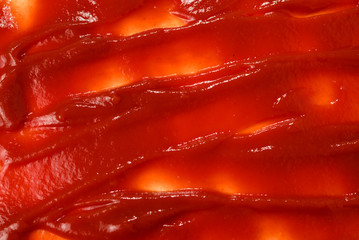 Red sauce splashes as background.