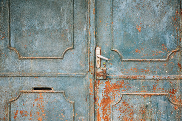 Blue metal doors. Old vintage style. Rusty texture.