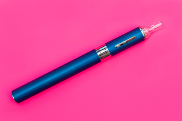 Vape pen metal electronic cigarette with vaping pink background
