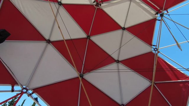 Little girl has fun jumping on a bungee cord trampoline attraction
