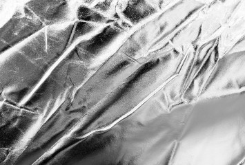 Crumpled silver material as abstract background