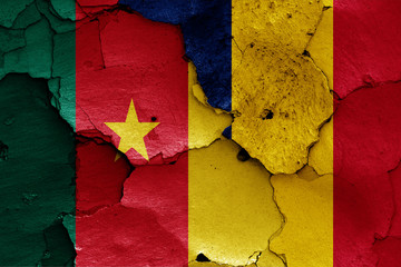 flags of Cameroon and Chad painted on cracked wall
