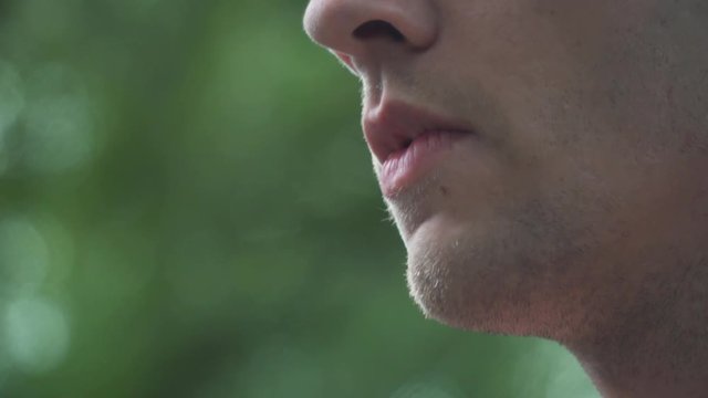 Close Up of Male Model Smoking Vaporizer Outside Slow Motion