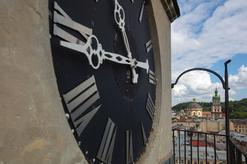 Naklejka premium View from tower of Bernardine church on clock and Lviv panorama
