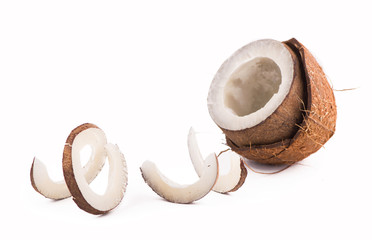 Coconut with half and leaves on white background
