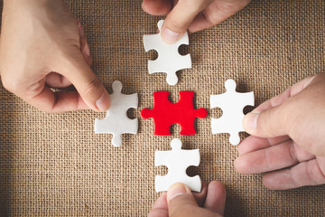 Business concept,  Group of business people assembling jigsaw puzzle and represent team support and help togethe - obrazy, fototapety, plakaty