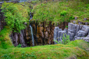 Buttertubs Limestone Pothole on Muker Common, The Buttertubs are a group of limestone potholes just off the roadside near the summit of Buttertubs Pass which runs between Swaledale and Wensleydale