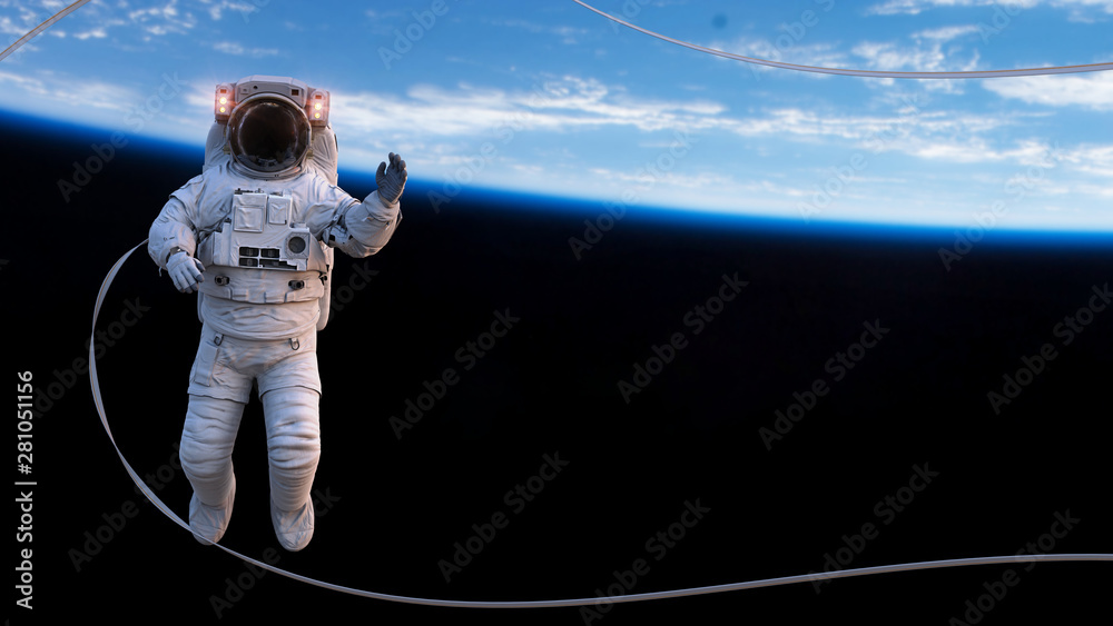 Canvas Prints astronaut with safety tether performing a spacewalk in empty space