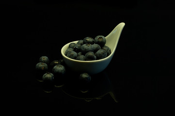 great image for the kitchen, on a black background blueberries for healthy people