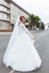 Obraz premium portrait of the bride in the city, young beautiful wedding bride