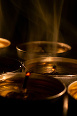 Candles close-up in the black background.