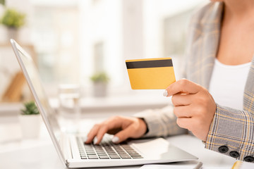 Hand of businessman entering her personal data while making order in online shop