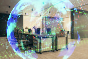 Stock and bond market graph and world map with trading desk bank office interior on background. Multi exposure. Concept of international finance